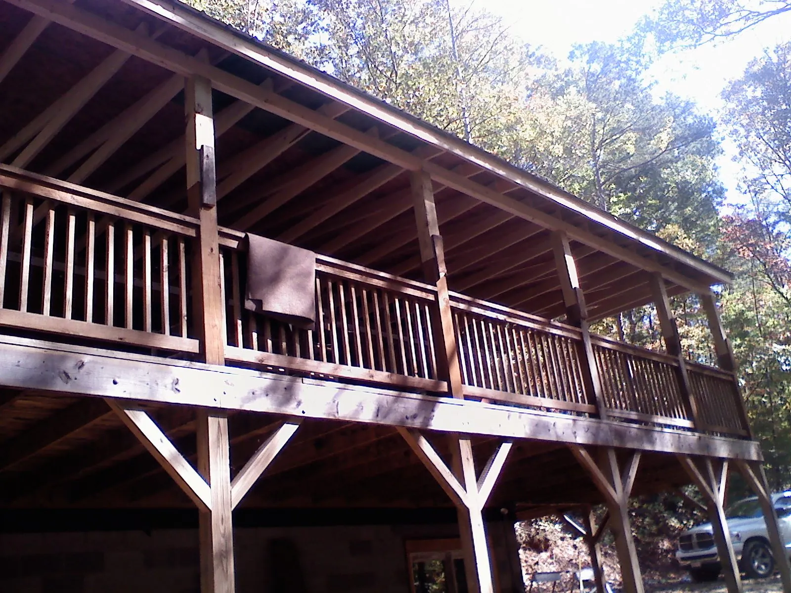 Timber framing under a new elevated porch and deck in Colfax